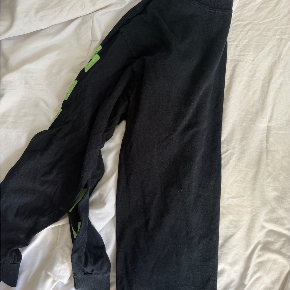 Black Shirt with Green Accents